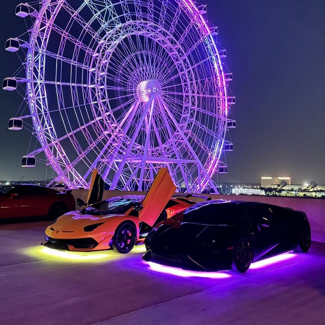 Lamborghini Aventador SVJ Yellow and Huracan with Underglow parked by ferris wheel in montreal canada getunderglow