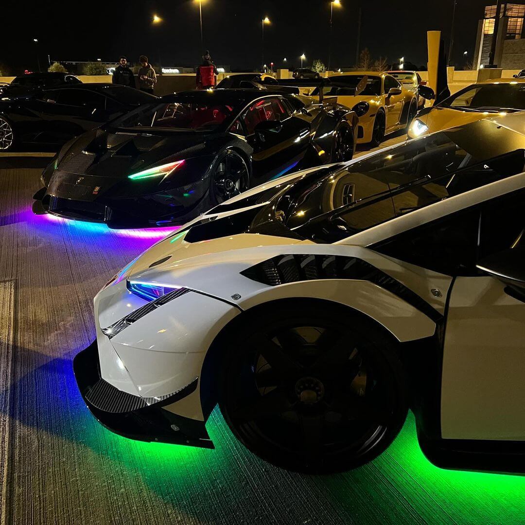 White and CARBON FIBER Lamborghini Huracan STO Widebody with Underglow in toronto canada getunderglow